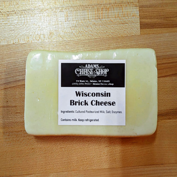 Closeup of a block of Wisconsin brick cheese.