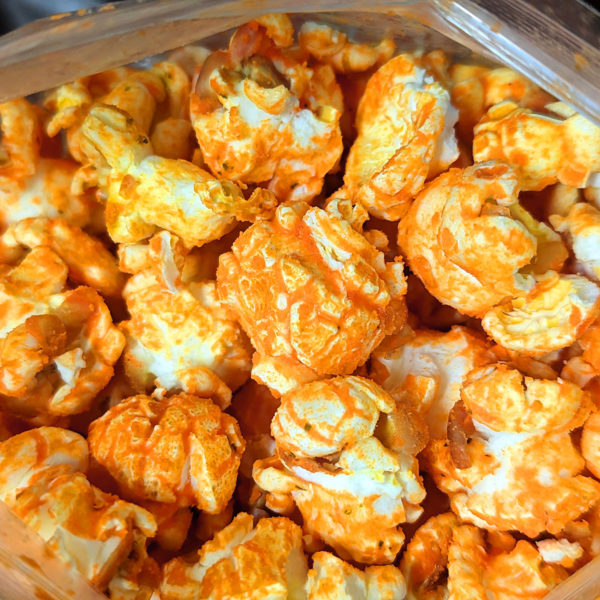 An open bag of Jala-pop-no flavored popcorn.