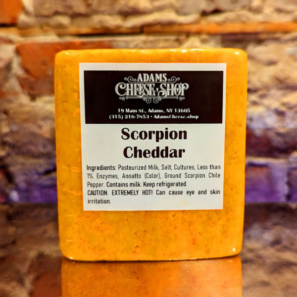 A block of Scorpion Cheddar cheese.