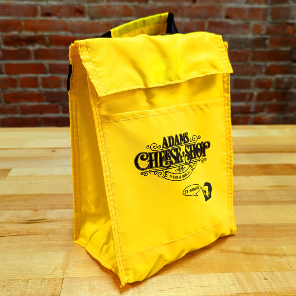 Three-quarters view of the Adams Cheese Shop insulated tote bag.