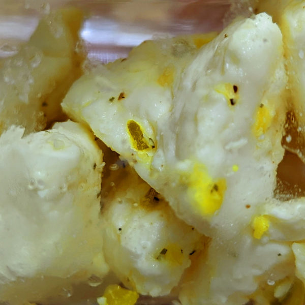 A closeup of Dill Pickle Flavored Cheese Curd.