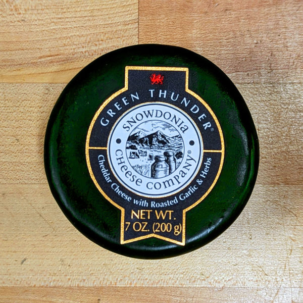 A truckle of Snowdonia Green Thunder Cheddar cheese.