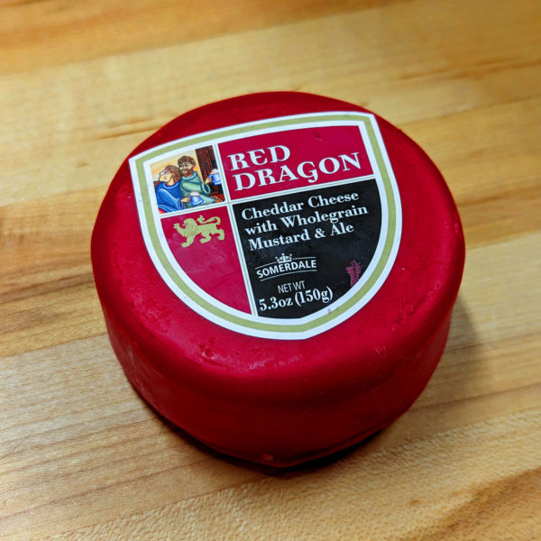 Alternate view of a truckle of Red Dragon cheese in wax.