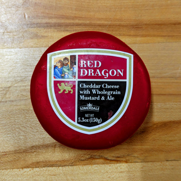 A truckle of Red Dragon cheese in wax.