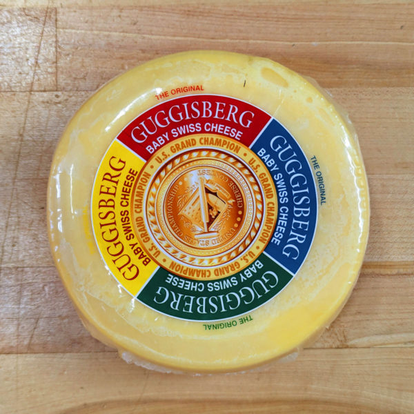 A 2 lb. wheel of Guggisberg Baby Swiss cheese.