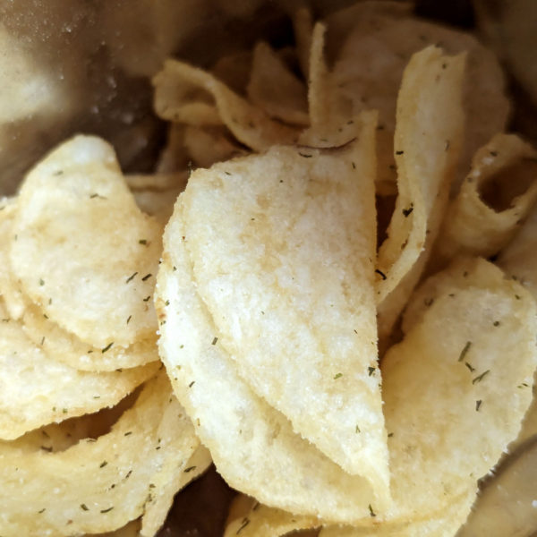 Inside a bag of Route 11 Dill Pickle Potato Chips.
