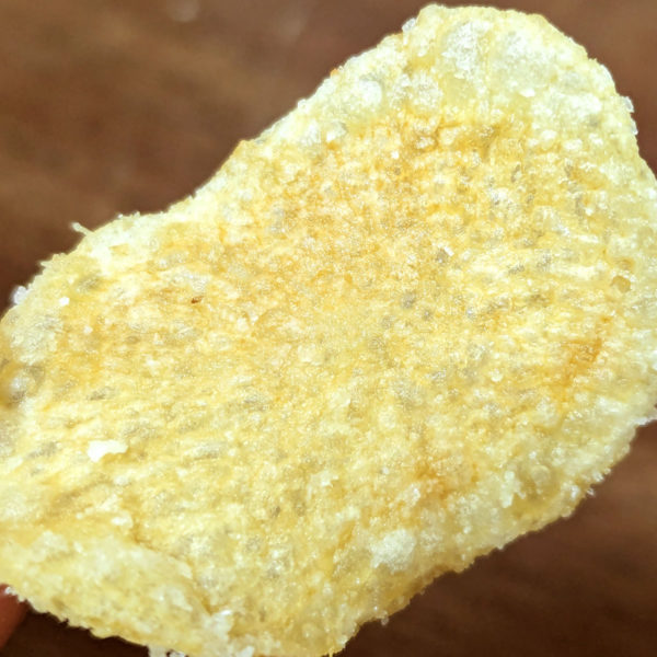 Extreme closeup of a Route 11 Salt and Vinegar potato chip.