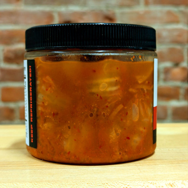 Back view of a jar of Barrel + Brine Classic Kimchi, revealing its contents.