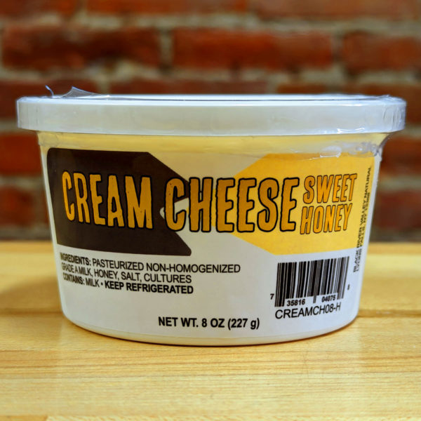 A tub of Sweet Honey Flavored Cream Cheese.