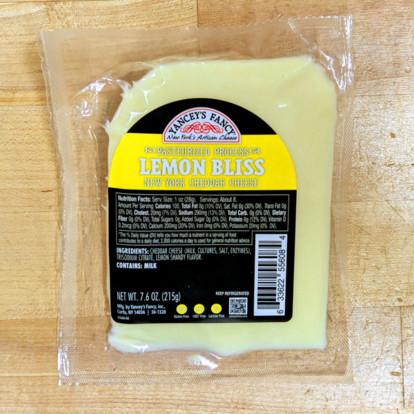 A wedge of Yancey's Fancy Lemon Bliss NY cheddar cheese.