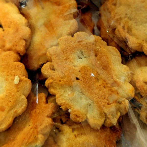 A closeup of Okina artisan biscuits with goat cheese.