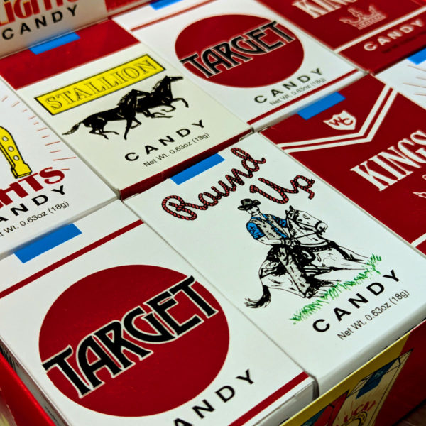 A closeup of assorted candy cigarette packaging.