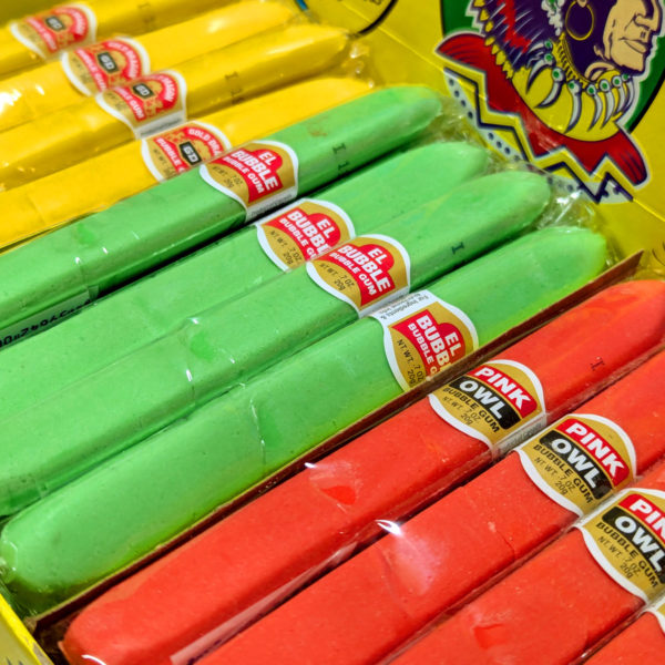 A closeup of an assortment of colorful bubble gum cigars.