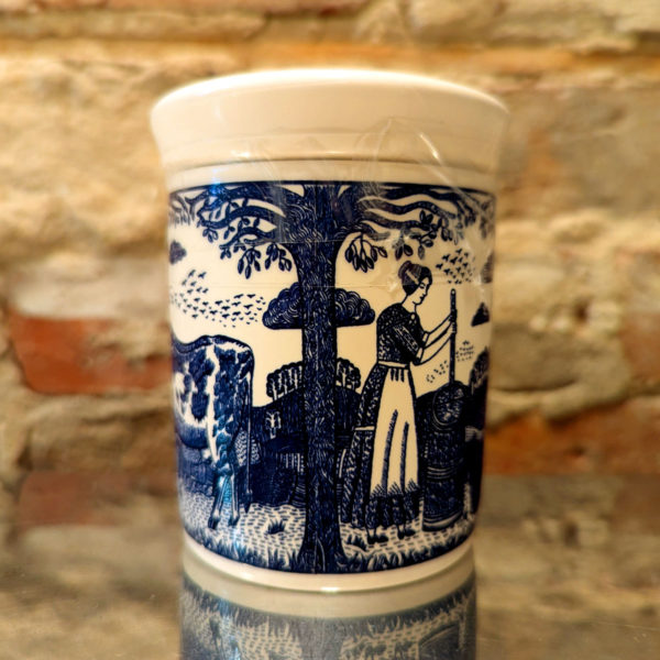 Detail of the illustration on a ceramic Stilton pot, featuring a woman using a butter churn.