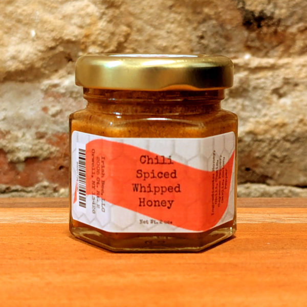 A sealed jar of Chili Spiced Whipped Honey.