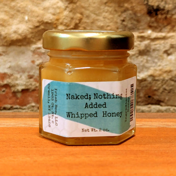 A sealed jar of Naked; Nothing Added Whipped Honey.