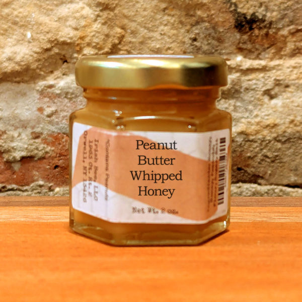 A sealed jar of Peanut Butter Whipped Honey.