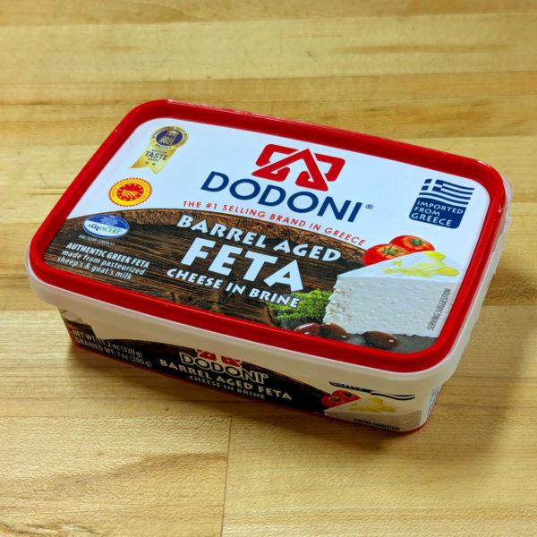 Closeup view of a container of Dodoni Barrel Aged Greek Feta.