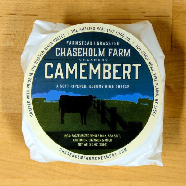 Chaseholm Farm Camembert, in its wrapper.