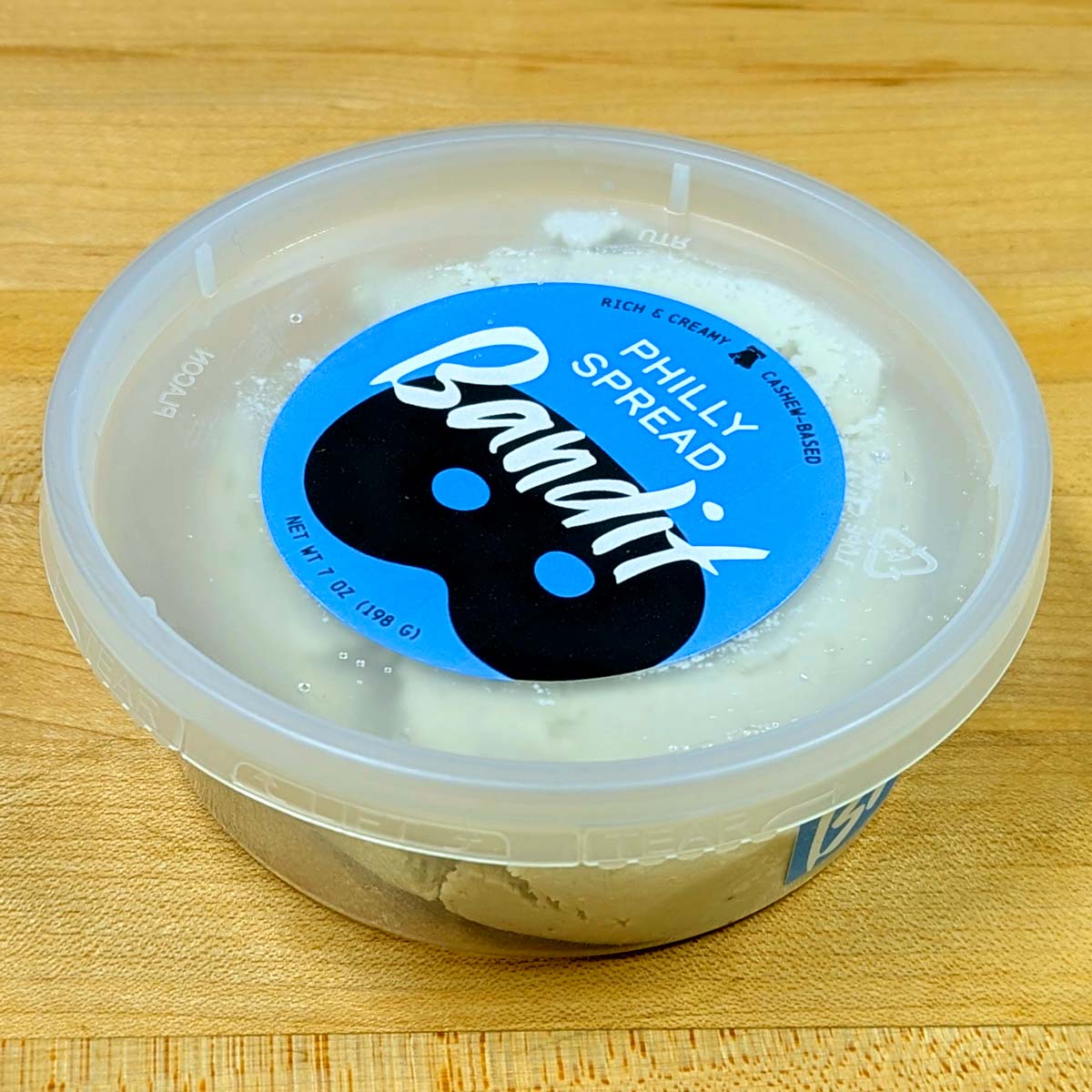 Side angle of a container of Bandit Philly Spread.