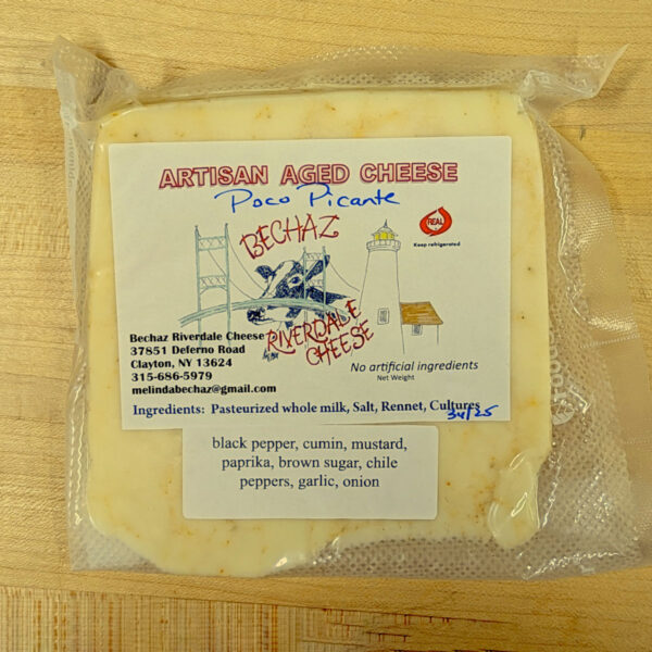 A wedge of Poco Picante brick cheese.