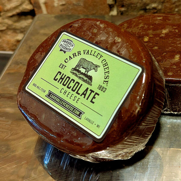 A slice of Chocolate Cheese, wrapped and labeled.