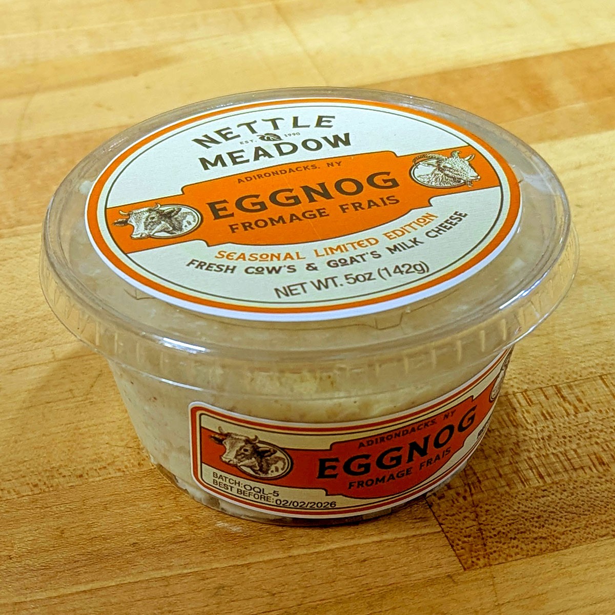 A container of Eggnog Frais cheese.