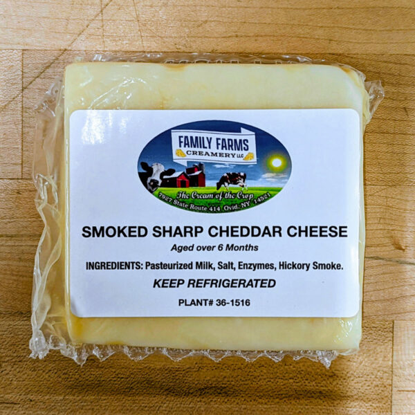 A block of smoked sharp cheddar cheese.