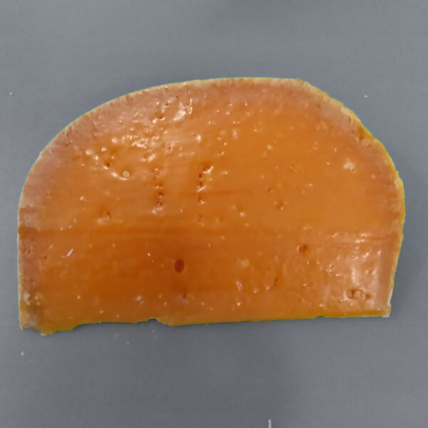 A wedege of Mimolette.